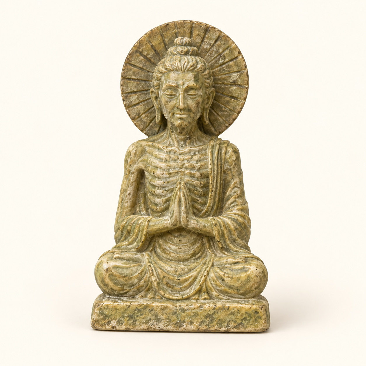 Small Ascetic Buddha on an ivory studio background