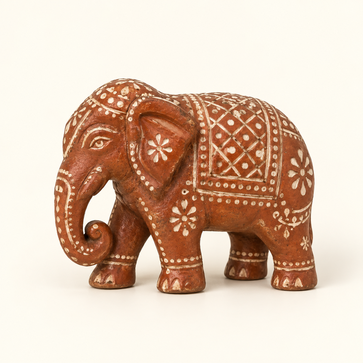 Red Patterned Elephant on an ivory studio background