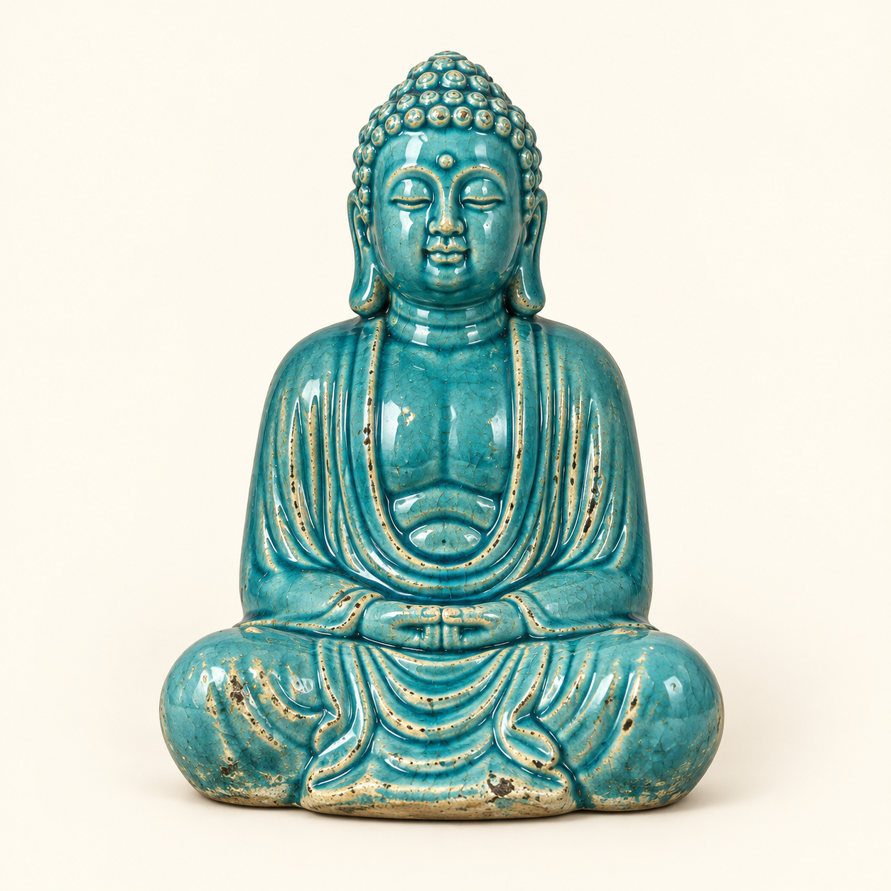 Turquoise Seated Buddha on an ivory studio background