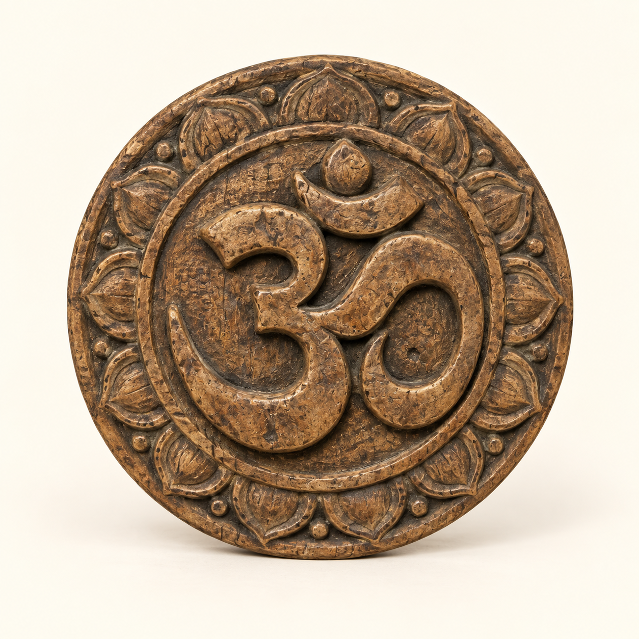 Carved Om Plaque on an ivory studio background